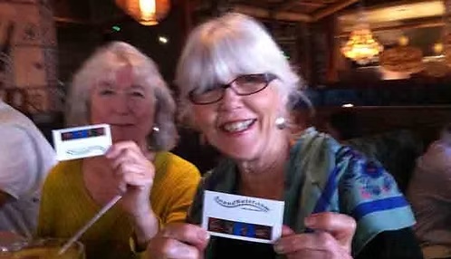 Supporters holding SoundWater cards