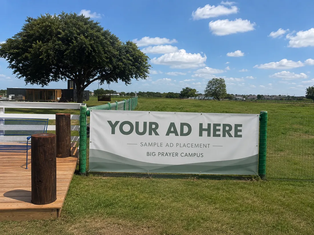 Available fence advertising banner reading Your Ad Here at Big Prayer Campus