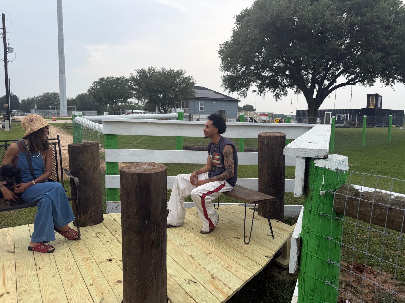 Visitors talking together at the Big Prayer Museum campus in Fulshear, Texas
